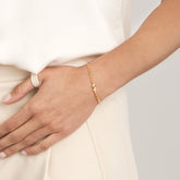14k Gold Double Puff Heart Station Paper Clip Bracelet on wrist